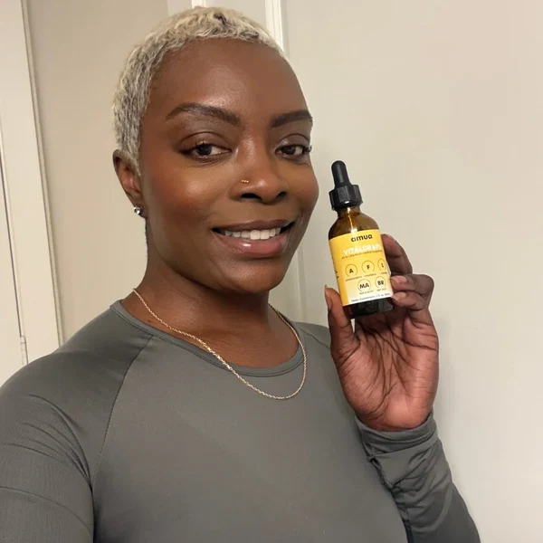 Amara L holding Amua Vitaldrops